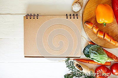 Flat lay of ingredient of cooking, vegetables around recipe book, grocering, local food Stock Photo