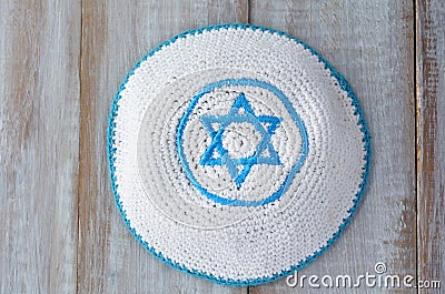 Flat lay of a Knitted kippah with embroidered blue and white Sta Stock Photo