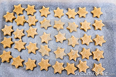 Flat lay - looking down on baking paper sheet with star shaped c Stock Photo