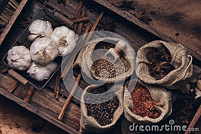 Flat lay of many spicy ingredient arrange in burlap and basket Stock Photo