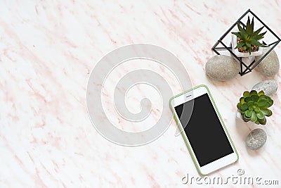 Flat lay office marble desk with phone, stones and succulents copy space background Stock Photo