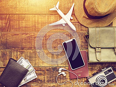 Flat lay of passport ,mobile ,plane model ,camera ,bag ,wallet Stock Photo