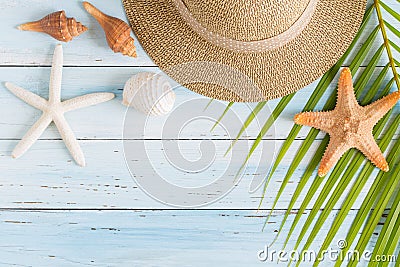 Flat lay photo coconut leaf and hat on wood background , top vie Stock Photo