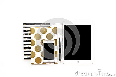 Flat lay photo of minimalistic white office desk with phone, tablet and stylish gold notebooks copy space background Stock Photo