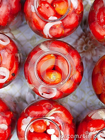 Flat lay pickled canned tomatoes in jars top view Stock Photo