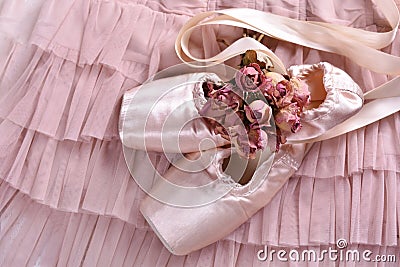 Ballet pointe shoes lying on tulle dress Stock Photo