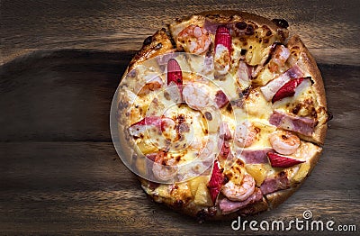 Flat lay Pizza pepperoni, mozzarella, oregano on a wood background Stock Photo