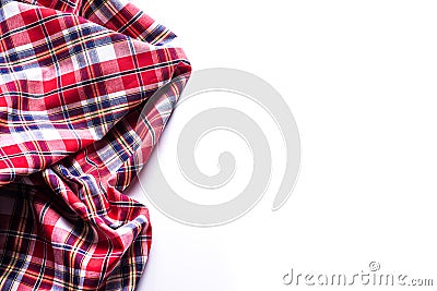 Flat lay of scarf with Christmas tartan texture on white background. Stock Photo