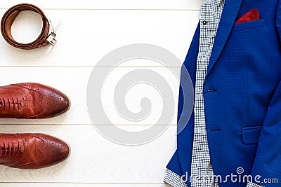 Flat lay set of classic mens clothes such as brown shoes, belt a Stock Photo