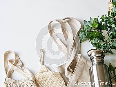 Flat lay set for shopping. Zero waste concept. Reusable fabric and metal bottle for liquids. Top view. copy space Stock Photo