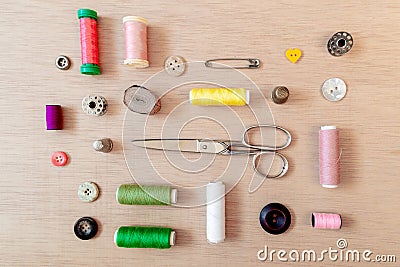 Flat lay of sewing materials: scissors, bobbin, buttons, safety pins, threads. Flat lay, top view Stock Photo