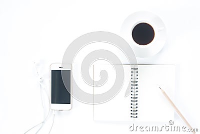 Flat lay of smartphone with empty notebook and coffee cup Stock Photo