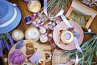 Flat lay spa and fashion accessories, handmade artisan soap, fresh flowers, wisp of bast Stock Photo