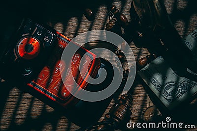 flat lay. still life of ancient and modern things. red mobile phone, dollar, Stock Photo