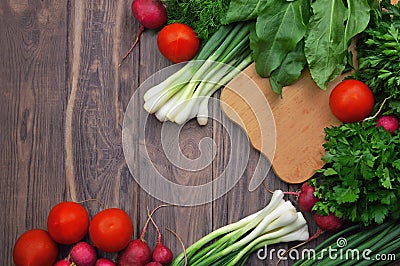 Flat-lay of tomatoes, radishes, parsley, spinach, dill, cilantro Stock Photo