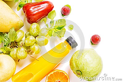 Flat lay top view plastic bottle with yellow mango juice with raw fruits isolated on white. Vegetarian drink concept. Detox Stock Photo