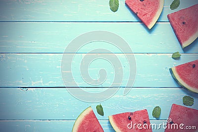 Flat lay top view watermelon slice, with mints which is a summer fruit on blue wooden table background copy space Stock Photo