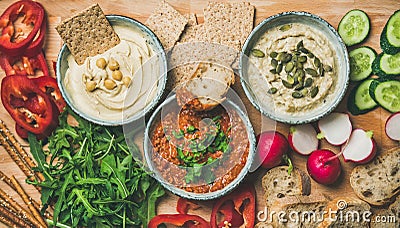 Flat-lay of Vegetarian dips hummus, babaganush, muhammara Stock Photo
