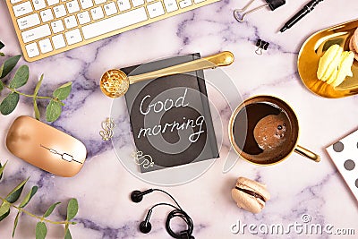 Flat lay. View from above. Business concept with a golden computer keyboard, macarons, a cup of coffee. Place for text. Stock Photo