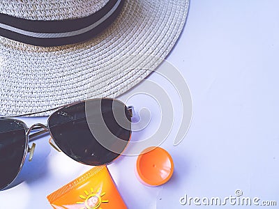 Flat lay view of summer and travel accessories. Hat, sun glasses, sunblock cream protection. Stock Photo