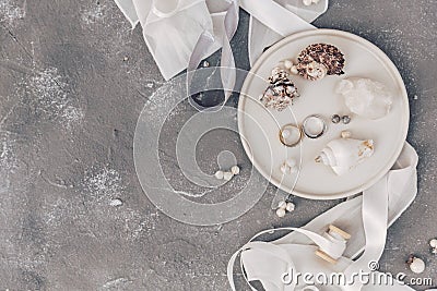 Flat lay wedding rings on shell, sea wedding concept decorations, Wedding symbols Stock Photo