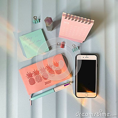 Flat layout of blank notepad with pen and stickers on colorful background Stock Photo