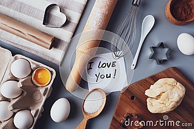 Flat layout composition, baking ingredients and kitchen utensils on a gray background. Culinary trendy background. The concept of Stock Photo