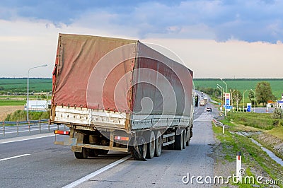 Flat out and damaged wheeler semi truck burst tires by highway s Stock Photo