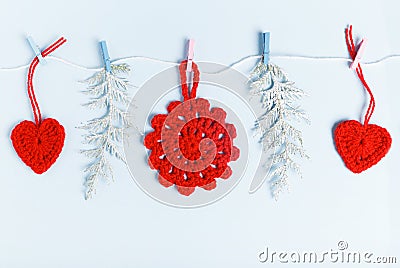 Flat pattern with red christmas decoration, conifer branches on blue background. Christmas frame decoration background. Stock Photo