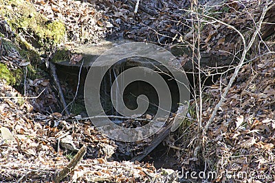 Flat rock with trickling water Stock Photo