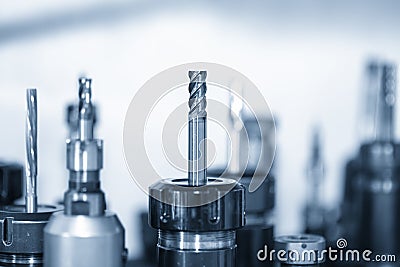 The flat or square solid carbide endmill tools with the holder in the light blue scene. Stock Photo