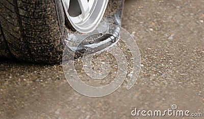 Flat tire car on side of street because expired tyre Stock Photo