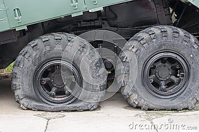 Flat tire of military vehicles Stock Photo