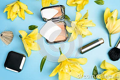 Flat view of cosmetics - lipstic, face-powder, brushes on color background Stock Photo