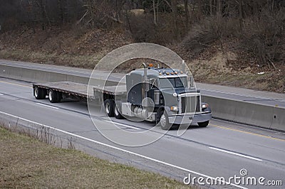 Flatbed Semi Truck on the Highway Stock Photo