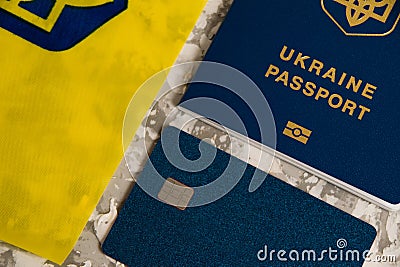 Ukraine, Chernihiv, July 5, 2023: Flatlay, the flag of Ukraine with the coat of arms, a bank card and a passport of a Editorial Stock Photo