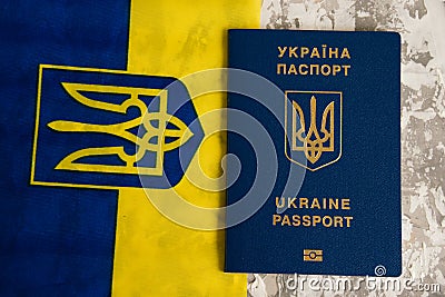 Ukraine, Chernihiv, July 5, 2023: Flatlay, flag of Ukraine with coat of arms and passport of citizen of Ukraine on light Editorial Stock Photo