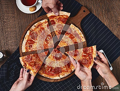 Flatlay. Friends eat pizza. Stock Photo