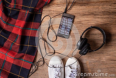 Flatlay of hipster sneaker shoes ,mobile phone with music and headphone. Urban outfit for everyday , fitness and healthy active li Stock Photo