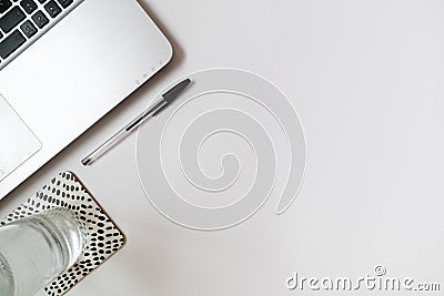 Flatlay laptop with pen and water bottle, working on a blog and e-learning Stock Photo