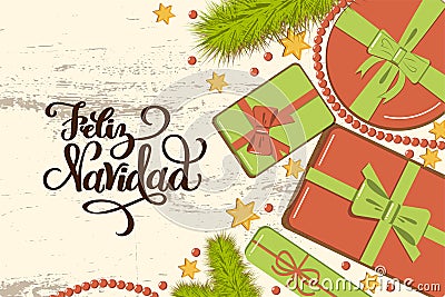 Flatlay mockup with fir, bright gift boxes with bow, beads and stars on rustic background with lettering Feliz Navidad Merry Stock Photo