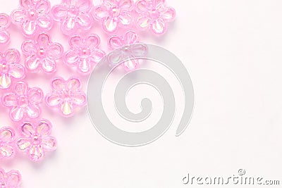 Flatlay Pink Plastic flower on white background Stock Photo