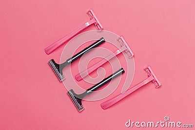 Skin Care Ideas. Flatlay Upper View Image of Five Colorful Pink and Black Disposable Razors Shavers Placed Reversed Over Trendy Stock Photo