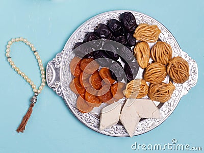 Flatley with rosaries, sweets, dates. The Concept Of Ramadan Stock Photo