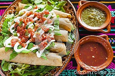 Flautas de pollo tacos and Salsa Homemade food Mexican mexico city Stock Photo