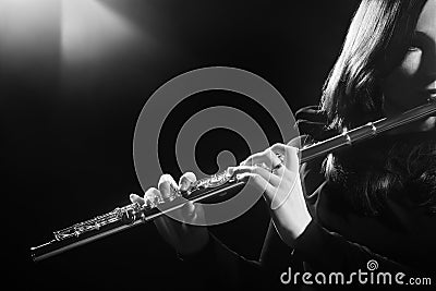 Flautist playing flute Stock Photo