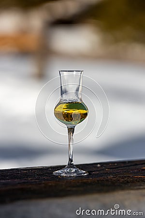 Flavored Grappa Schnapps glass in Cortina d`Ampezzo, Dolomites, Italy Stock Photo