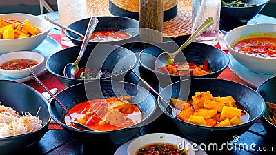 Flavors of Thailand with a variety of traditional dishes in a sea restaurant Stock Photo