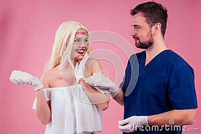 Flawless face of young beautiful blonde long hair patient woman and doctor surgery consulting about breast augmentation Stock Photo