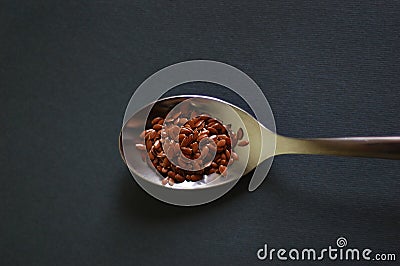 Flax seeds in a spoon Stock Photo